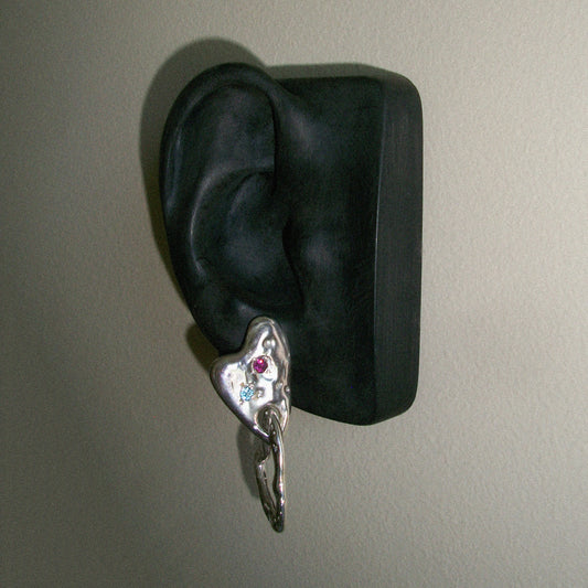 Handmade double asymmetric heart earrings with rhodolite and topaz. Each pair is unique. On ear