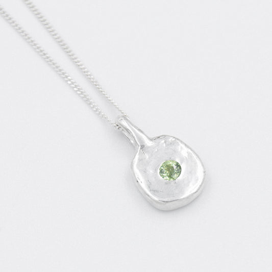 Daras Space Pendant with green sapphire. Side