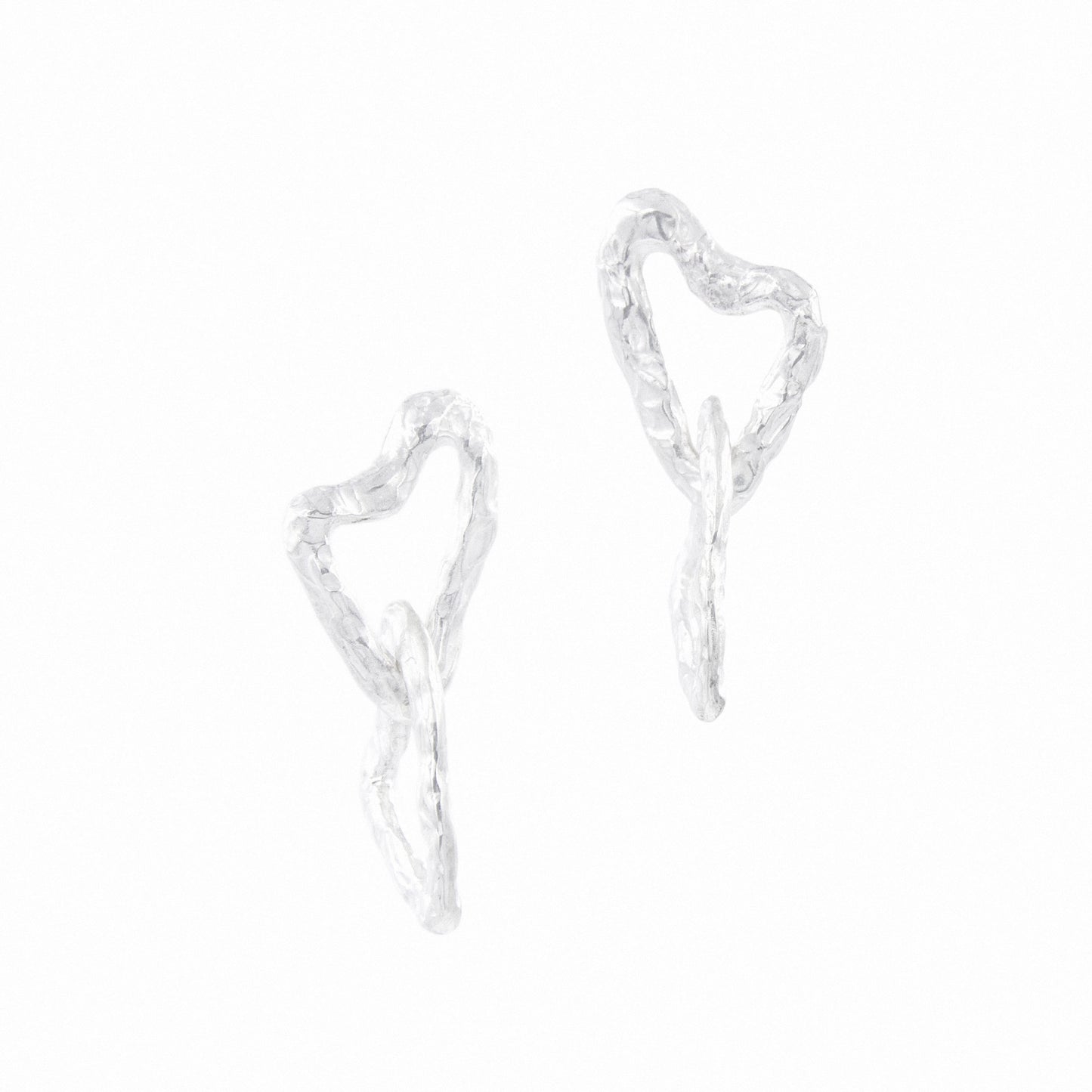 Daras Space Handmade double asymmetric heart earrings. Front