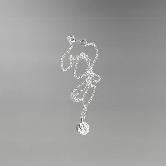 Silver necklace with a foil texture pendant