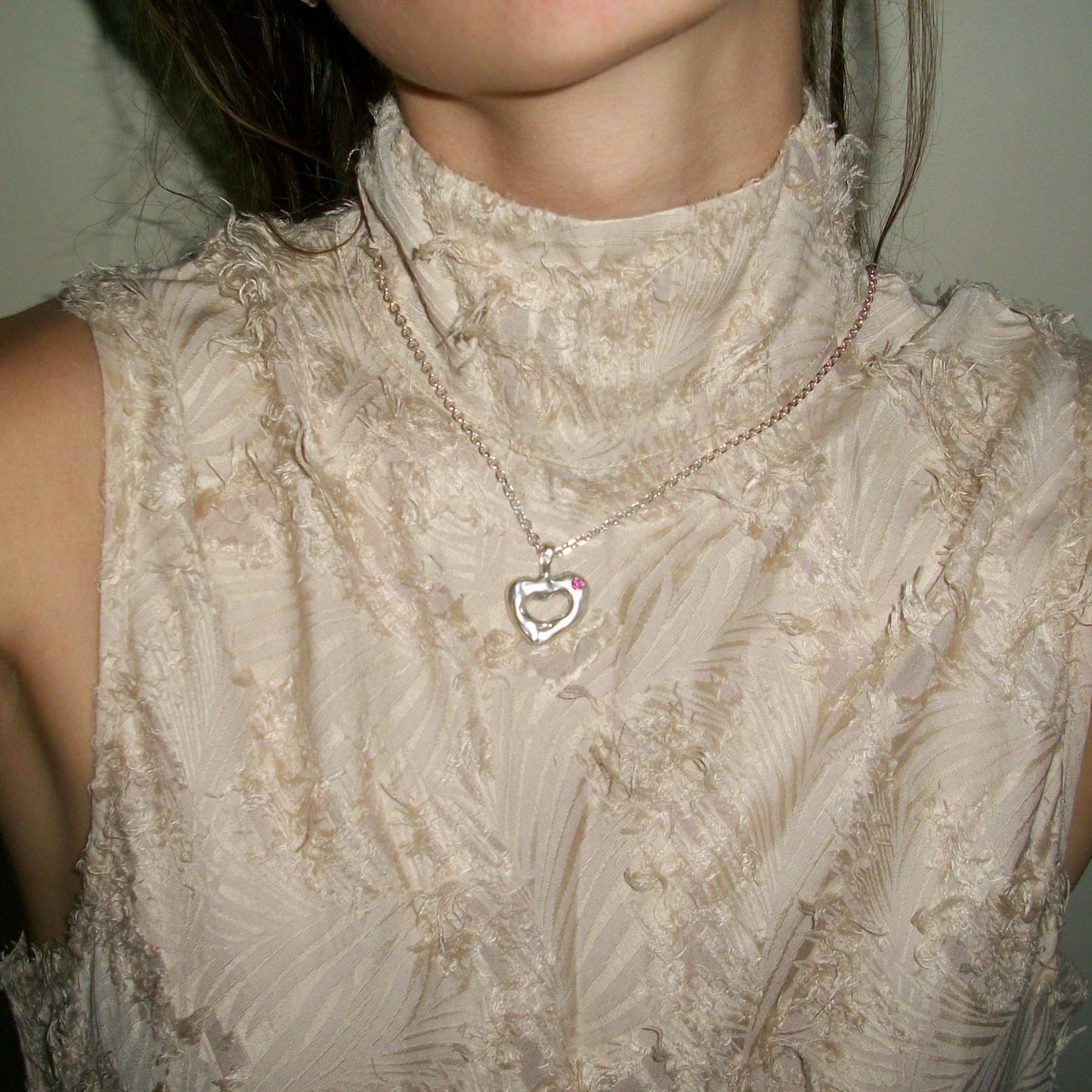 Melted heart necklace with topaz. Each pendant is unique. On neck