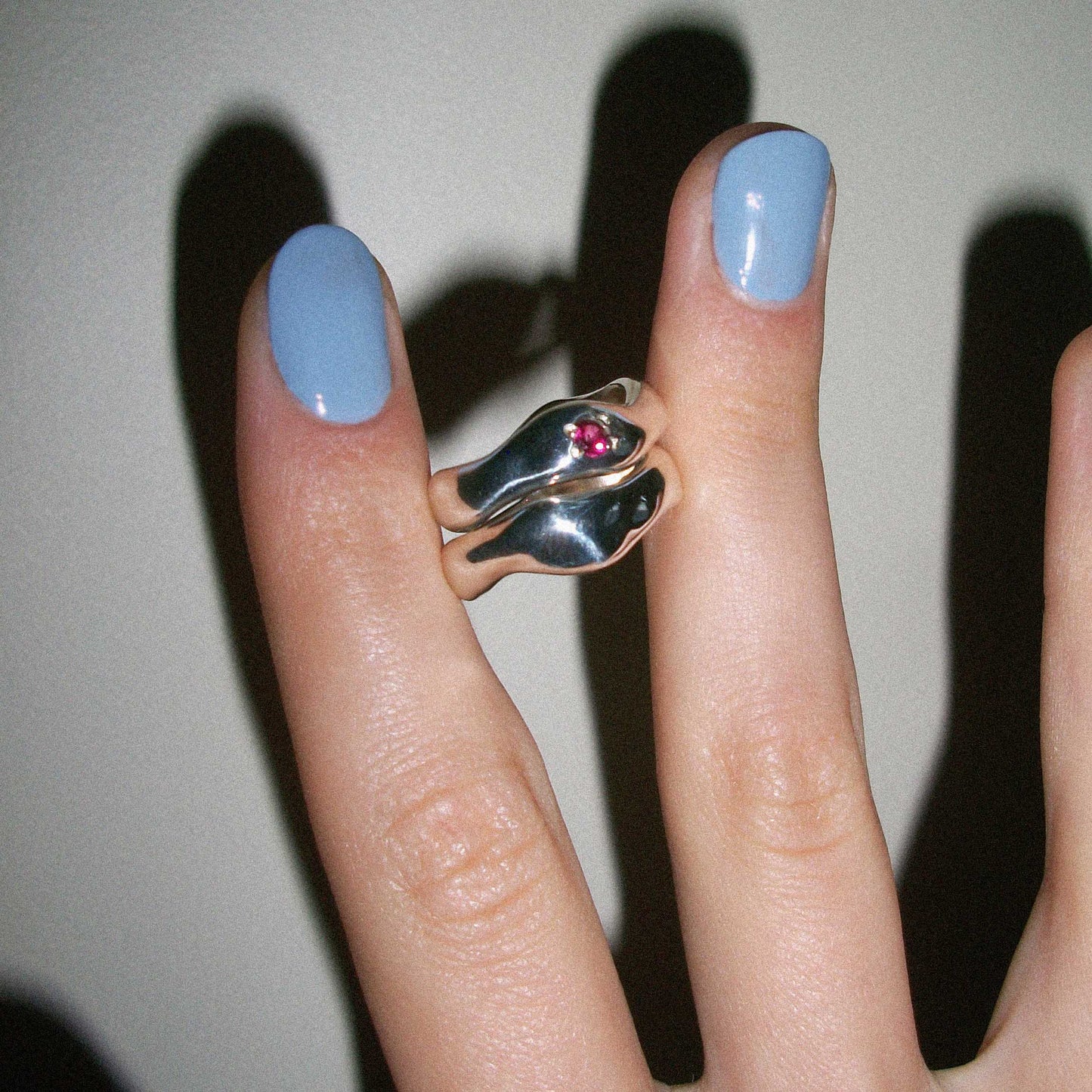 Motion ring with gemstone paired with motion ring.