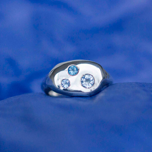 Silver ring with blue topaz gemstones